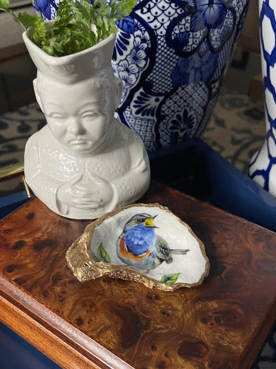 Decorative oyster shell with a bluebird design