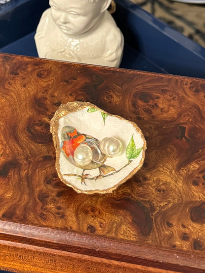 Handcrafted oyster shell titled 'Single Songbird' featuring petite oyster display shell, bird collection design, shown in a styled product display.