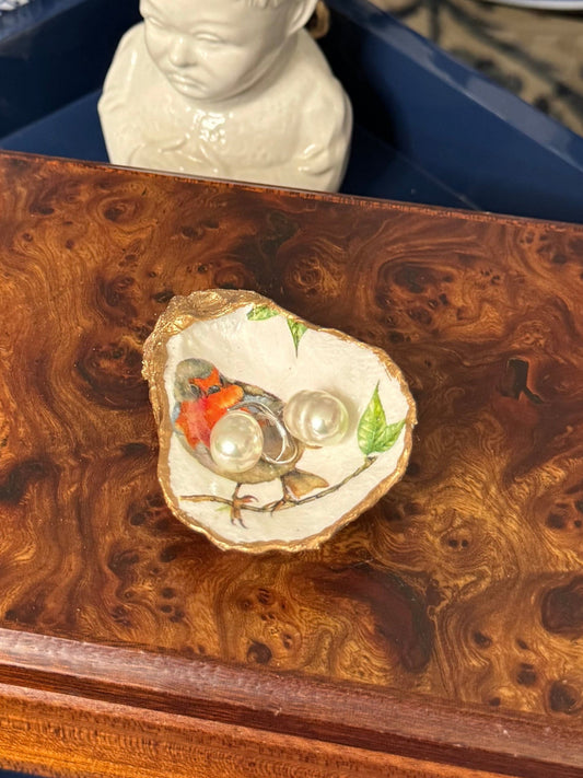 Handcrafted oyster shell titled 'Single Songbird' featuring petite oyster display shell, bird collection design, shown in a styled product display.
